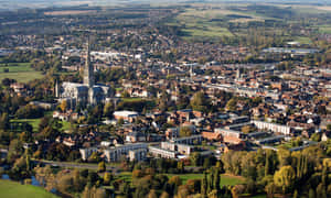 Majestic View Of Salisbury Cathedral At Sunset Wallpaper