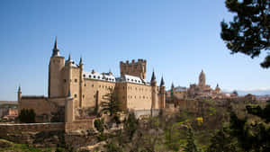 Majestic View Of Segovia Castle At Sunset Wallpaper