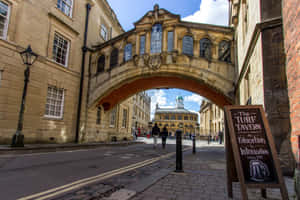 Majestic View Of The Bridge Of Sighs Above The Turf Tavern Alley Wallpaper