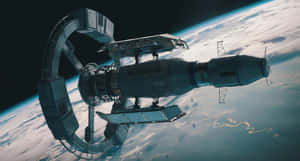 Majestic View Of The Space Station In Earth's Orbit Wallpaper