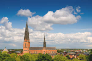 Majestic View Of Uppsala Cathedral At Dusk Wallpaper