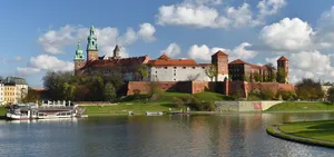 Majestic View Of Wawel Castle From The Vistula River Wallpaper