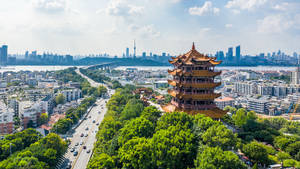 Majestic View Of Yellow Crane Tower During Daytime In Wuhan Wallpaper