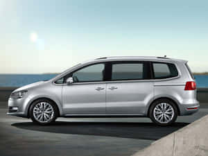 Majestic Volkswagen Sharan Cruising Down The Highway Wallpaper