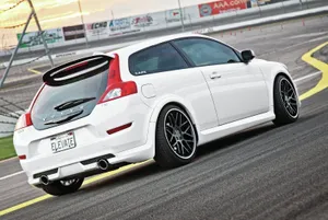 Majestic Volvo C30 Cruising On A Suburban Road Wallpaper