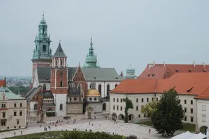 Majestic Wawel Castle Under Gray Skies Wallpaper