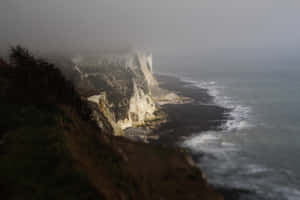 Majestic White Cliffs Of Dover In Stormy Weather Wallpaper