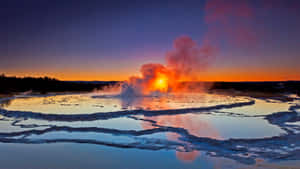 Majestic Yellowstone Geysers Erupting At Dusk Wallpaper