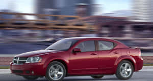 Majestically Gleaming Dodge Avenger In Sunset Wallpaper