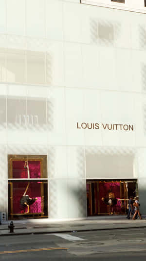 Make A Style Statement With This Glamorous Louis Vuitton Iphone Wallpaper