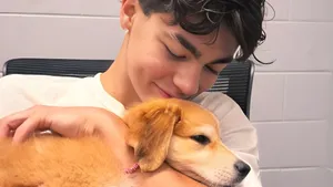 Malachi Barton With Puppy Wallpaper