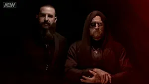 Malakai Black With Brodie King In Dimly Lit Room Wallpaper