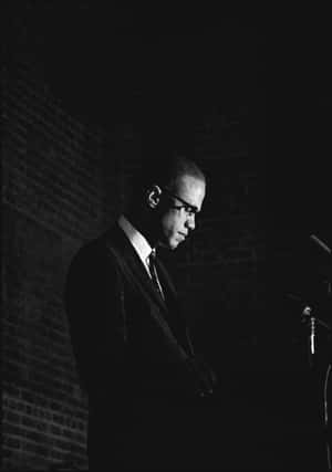 Malcolm X Speakingat Podium Wallpaper