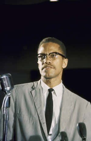 Malcolm X Speakingat Podium Wallpaper