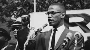 Malcolm X Speakingat Rally Wallpaper