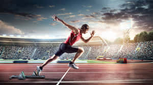 Male Athlete Sprinting On Tracks Wallpaper