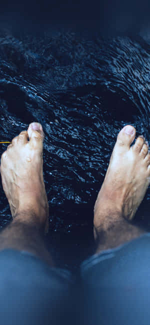 Male Feet On The Stream Wallpaper