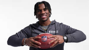 Malik Nabers Holding Football Wallpaper