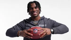 Malik Nabers Holding Football Wallpaper