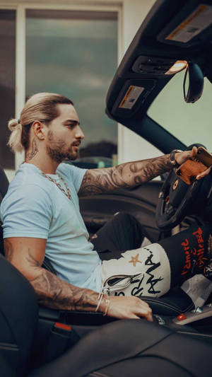 Maluma Baby Driving A Ferrari Wallpaper