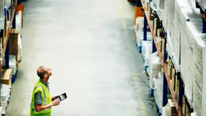 Man Assessing The Wholesale Products Wallpaper