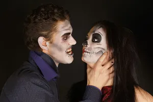 Man Choking A Woman With Face Paint Wallpaper