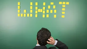 Man Contemplating Task Board Wallpaper