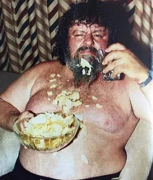 Man Eating Chipsand Drinking Wallpaper