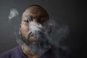 Man Exhaling Smoke Wallpaper