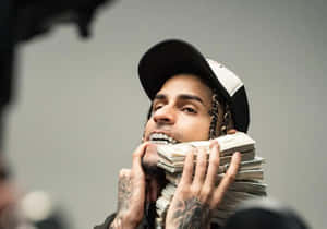 Man Holding Cash Stacks Wallpaper