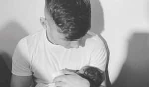 Man Holding Newborn Baby Monochrome Wallpaper