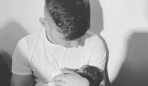 Man Holding Newborn Baby Monochrome Wallpaper