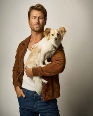 Man Holding Small Dog Portrait Wallpaper