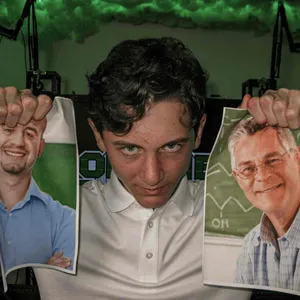 Man Holding Two Printed Faces Wallpaper