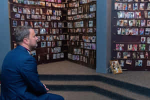 Man In Suit At Kigali Genocide Memorial Wallpaper