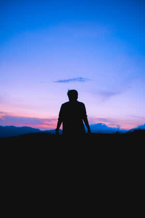 Man Looking At Glorious Sky Wallpaper