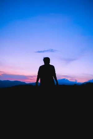 Man Looking At Glorious Sky Wallpaper