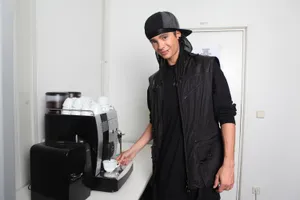 Man Making Coffee Backstage Wallpaper