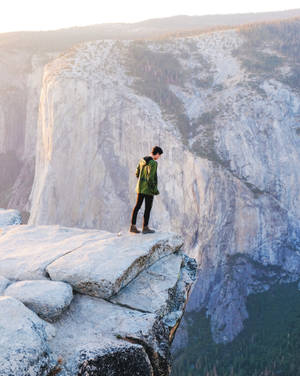 Man On A Cliff Iphone Live Wallpaper