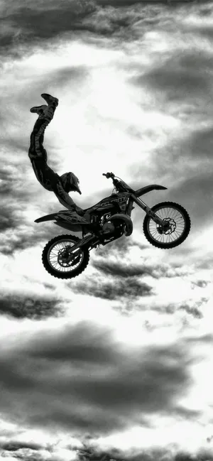 Man On Motorcycle In Sky [wallpaper] Wallpaper