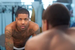 Man Reflectingin Mirror Wallpaper