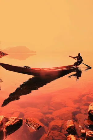 Man Rowing On A Boat Wallpaper