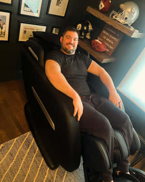 Man Smilingin Sports Themed Room Wallpaper