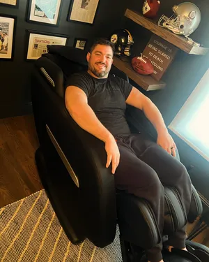 Man Smilingin Sports Themed Room Wallpaper