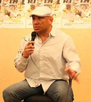 Man Speakingat Event Wallpaper