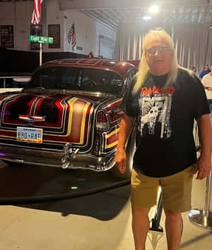 Man Standing Beside Classic Car Wallpaper