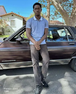 Man Standing By Vintage Car1986 Wallpaper