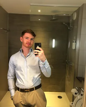 Man Taking Selfiein Mirror.jpg Wallpaper