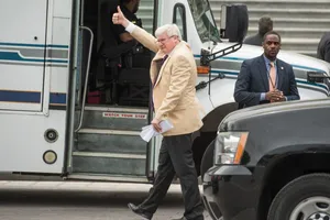 Man Waving Exiting Bus Wallpaper