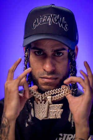 Man_with_ Glizzy Gang_ Cap_and_ Chains Wallpaper